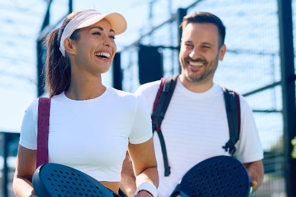 couple on a padel court